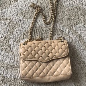 Nude purse with gold spike studs